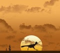 A road runner bird is seen running in front of a setting sun and cactus in the distance