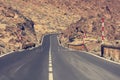 Road running through arid volcanic wasteland On Tenerife. Royalty Free Stock Photo