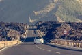 Road running through arid volcanic wasteland On Tenerife. Royalty Free Stock Photo