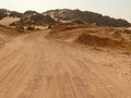 The road running through the Sahara desert.