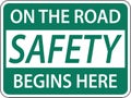 On The Road Safety Begins Here Sign On White Background