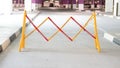 Road Safety Block Traffic Metal Portable Retractable Barricade at a parking spot