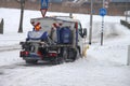 Road salt dispencer and snow plow on the streets during snow roads by municipality Zuidplas