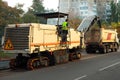 Road Scraping Machine Removes Old Asphalt During Construction.