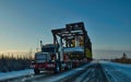 On the road A semi truck hauls a pipework mod on highway 63 Alberta