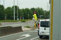 A road service electrician repairs a traffic light.