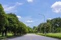 A road with a shady atmosphere and trees on the side of the road Royalty Free Stock Photo