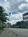 Road with shady trees and clouds