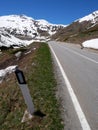 Road side black and white indicator sign in italian mountains Royalty Free Stock Photo