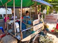 A road side sugar cane juice seller prepares juice on Silk Island / Koh Dach, Cambodia