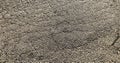 Road sidewalk concrete driveway street closeup overhead detail asphalt roadway