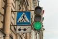 adjustable pedestrian crossing in blue with a badge for blind pedestrians in the form of black glasses Royalty Free Stock Photo