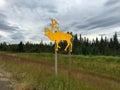 A Road Sign Along the Alcan under a Cloudy Sky