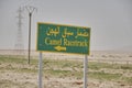 road sign with arabien letters saying camel race track