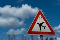 Road sign with areoplane on a blue cloudy sky Royalty Free Stock Photo