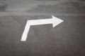 Road sign arrow at asphalt texture surface Royalty Free Stock Photo