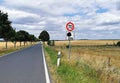 Road sign Attention trees and thus dangerous accident risk for cars Royalty Free Stock Photo