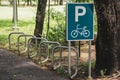 Road Sign, Bicycle parking symbol and bicycle parking rack , Bicycle park area sign in square frame in public park Royalty Free Stock Photo