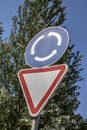 Road sign on blue sky background