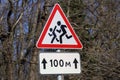 Road sign cautious children. Driver's warning about people running