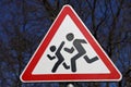 Road sign cautious children. Driver's warning about people running