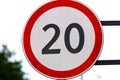 road sign circle with red rim and number inside. speed limit