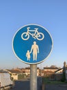 Road sign cycle and pedestrian pathway clear blue sky in background