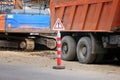 Road sign dangerous work on the background of construction or repair of a road in the city