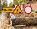 Road sign Detour. Construction workers make repairs urban highways engineering Royalty Free Stock Photo