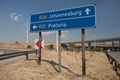 Road sign directions by car from or Tambo airport Royalty Free Stock Photo