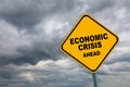 Road sign Economic crisis with dark cloud background. Royalty Free Stock Photo