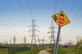 Road sign + electrical towers