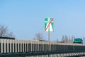 Road sign end of a motorway on a highway against blue sky Royalty Free Stock Photo