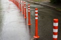 Road sign flexible plastic bollards with pedestrian white marking line and arrow sign on cement floor in parking car Royalty Free Stock Photo