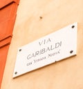 Road sign in genoa italy indicating ancient via garibaldi