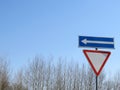 Road sign: give way, turn left Royalty Free Stock Photo