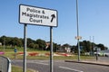 Road sign giving directions to police station and magistrates court