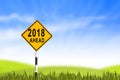 2018, Road sign in the grass field to new year and blue sky, can Royalty Free Stock Photo