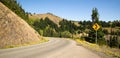 Road Sign Indicates Curves Ahead Mountain Landscape Royalty Free Stock Photo