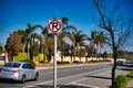 A road sign indicates no parking allowed