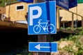 a road sign indicating bicycle parking attached to a pole Royalty Free Stock Photo