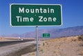 Road sign indicating Mountain Time Zone