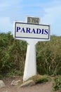 Road sign indicating Paradise in french