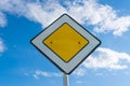 Road sign main road on the background of the sky with clouds Royalty Free Stock Photo