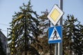 Road sign main road with pedestrian crossing sign. Speed main road daytime. Road rules International road sign Main road Royalty Free Stock Photo