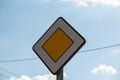 Road sign main road. Speed main road daytime. Road rules International road sign Main road or Priority road against blue Royalty Free Stock Photo