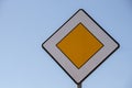 Road sign main road. Speed main road daytime. Road rules International road sign Main road or Priority road against blue Royalty Free Stock Photo