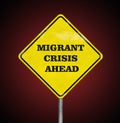 A road sign Migrant Crisis Ahead on ruby