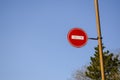 Road sign No entry against the blue sky and trees Royalty Free Stock Photo