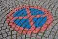 Road sign no stopping painted on a cobblestone street Royalty Free Stock Photo